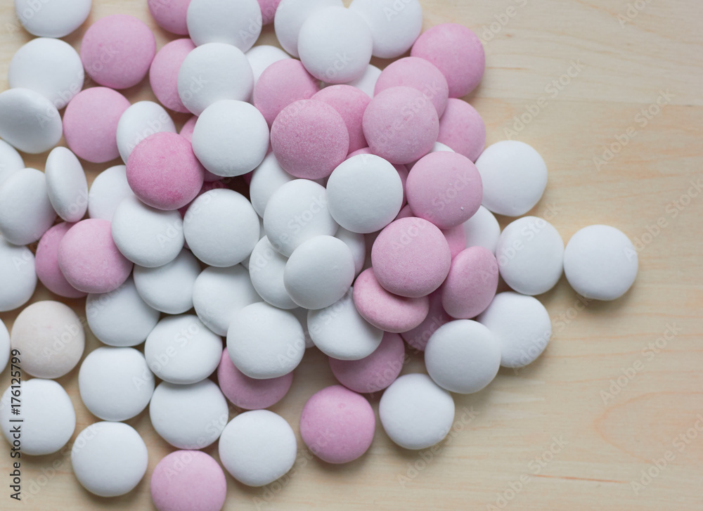 colored round candy scattered on the table colored round candy scattered on the table