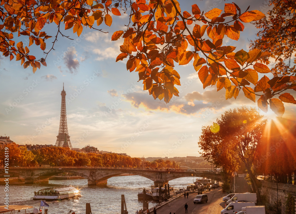 Obraz premium Paris with Eiffel Tower against autumn leaves in France