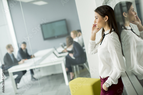 Modern business woman using...