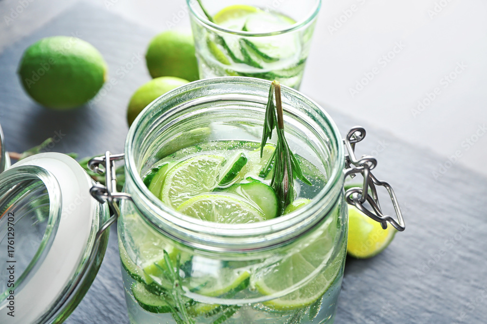 Jar with fresh rosemary drink on table Jar with fresh rosemary drink on table