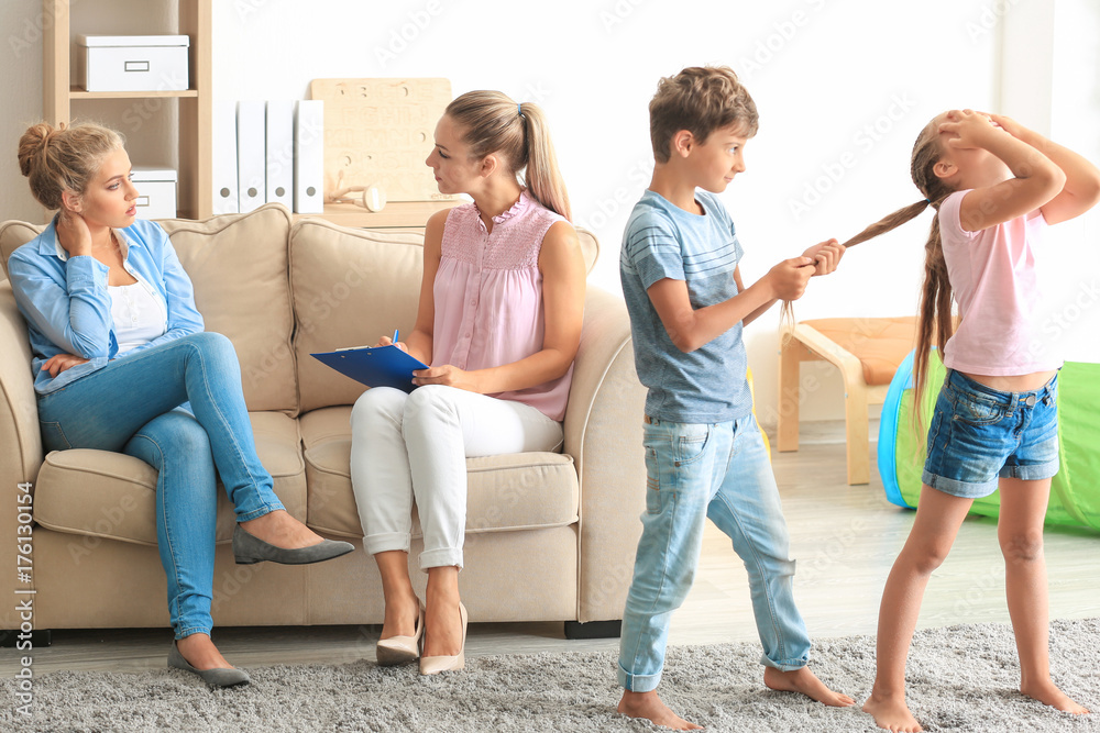 Young child psychologist working with family in office Young child psychologist working with family in office