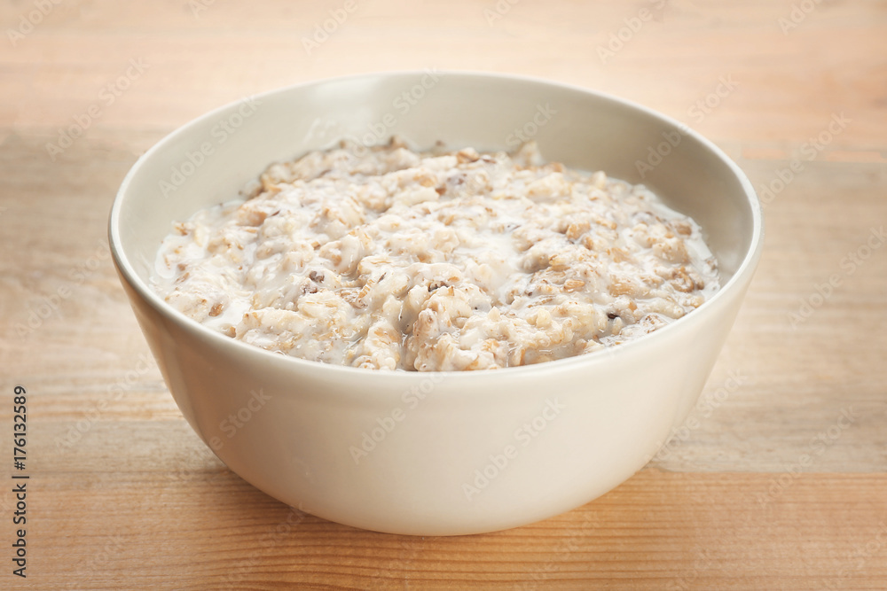 Tasty oatmeal in bowl for breakfast on table Tasty oatmeal in bowl for breakfast on table