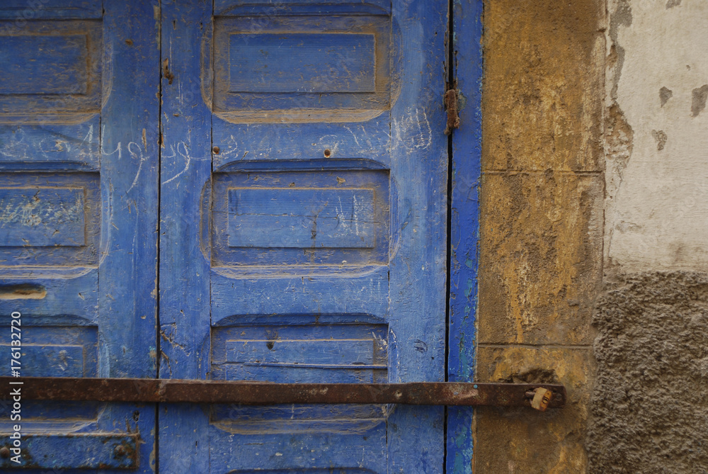 Wooden locked blue door in Morocco