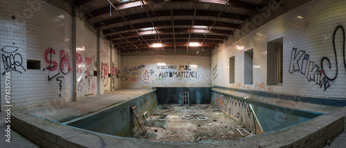 Panorama of interior of abandoned building with swimming pool