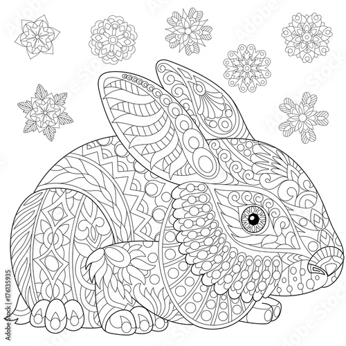 Coloring page of rabbit (bunny) and winter snowflakes. Freehand sketch drawing for adult antistress coloring book in zentangle style with doodle elements.