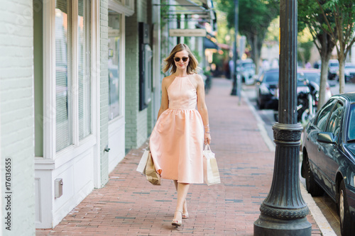Beautiful woman in a dress out shopping