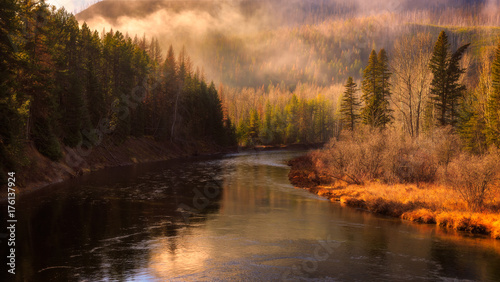 Obraz na płótnie Fog rolls over the Middle Fork Flathead river in Glacier National Park, Montana