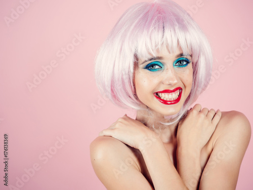 Girl smiling with bright artificial hair.