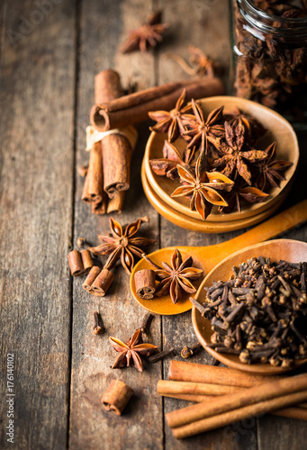 Fototapeta Naklejka Na Ścianę i Meble -  Aromatic spices on the wooden table