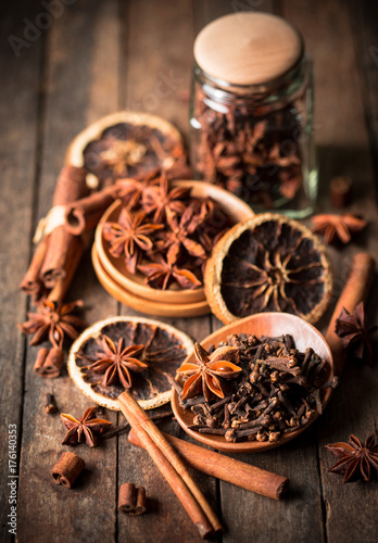 Fototapeta Naklejka Na Ścianę i Meble -  Aromatic spices on the wooden table