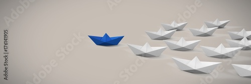 Group of Paper boats on soft pink background