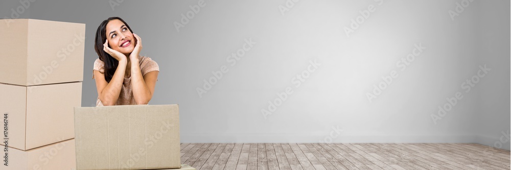 Thoughtful woman in 3d room with boxes