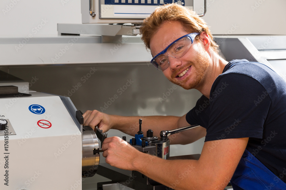 Αυτοκόλλητο Fitter working at Turning machine in metal workshop