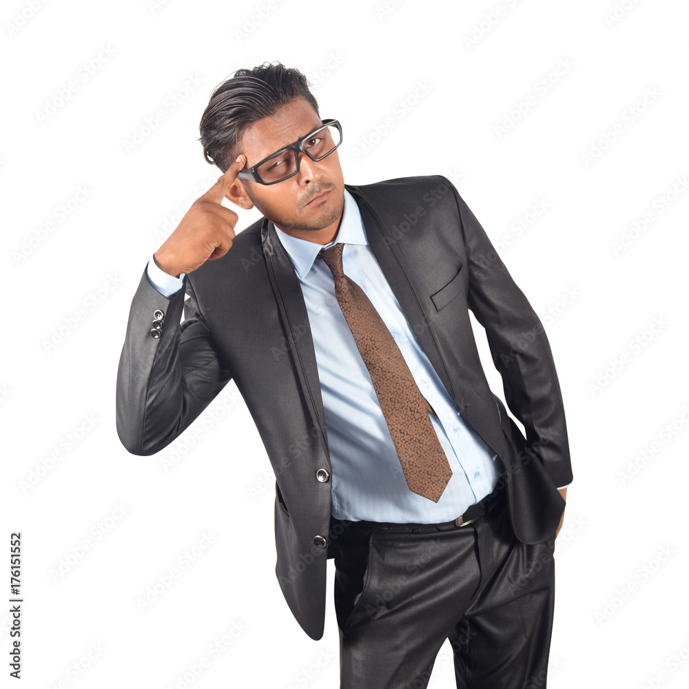 Confused businessman in black suit gesturing head with finger over white background Confused businessman in black suit gesturing head with finger over white background