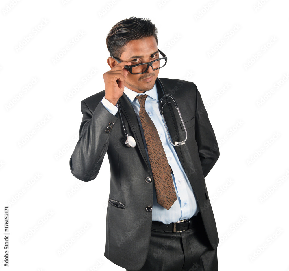 Doctor with stethoscope in black suit presenting and showing over white background Doctor with stethoscope in black suit presenting and showing over white background