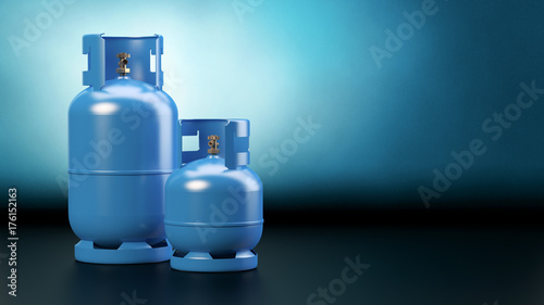 Fotografia Two blue gas bottles - dark background