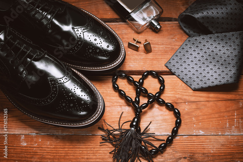 Men accessories. Shoes with tie, perfume and cuff