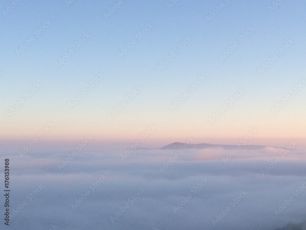 mountains over clouds
