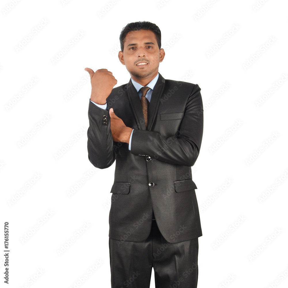 Portrait of a young businessman in black suit pointing away over white background Portrait of a young businessman in black suit pointing away over white background