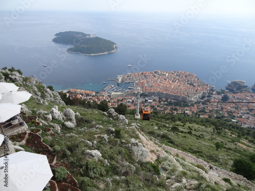 Aerial view of the hill and the cable car to the city of Dubrovnik, with the Island of Lokrum in the background.
