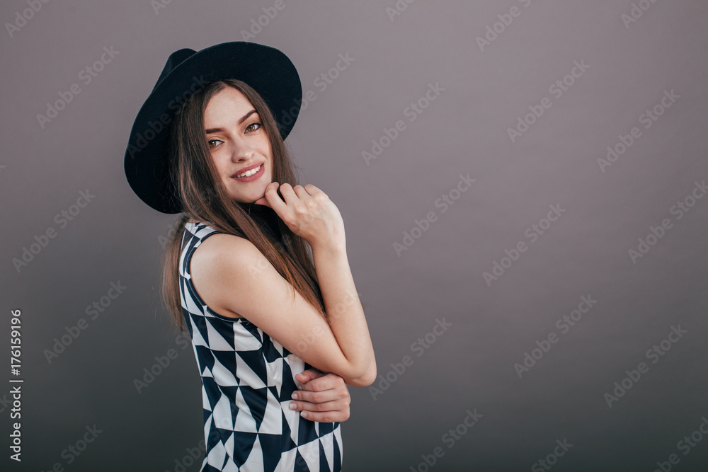 Young beautiful fashionable woman with trendy makeup in black hat and glasses on the grey background . Model looking at camera, wearing stylish eyeglasses. Female fashion, beauty concept.
Young beautiful fashionable woman with trendy makeup in black hat and glasses on the grey background . Model looking at camera, wearing stylish eyeglasses. Female fashion, beauty concept.