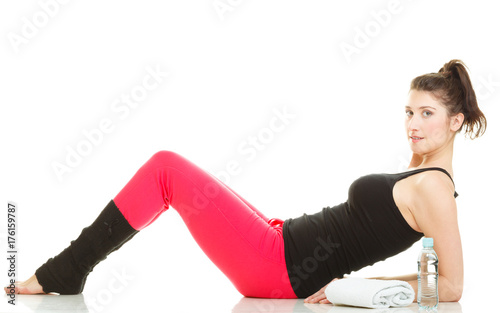Fit girl stretching isolated on white.