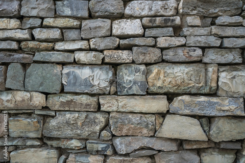 Closeup of old stone wall use for construction business and designers