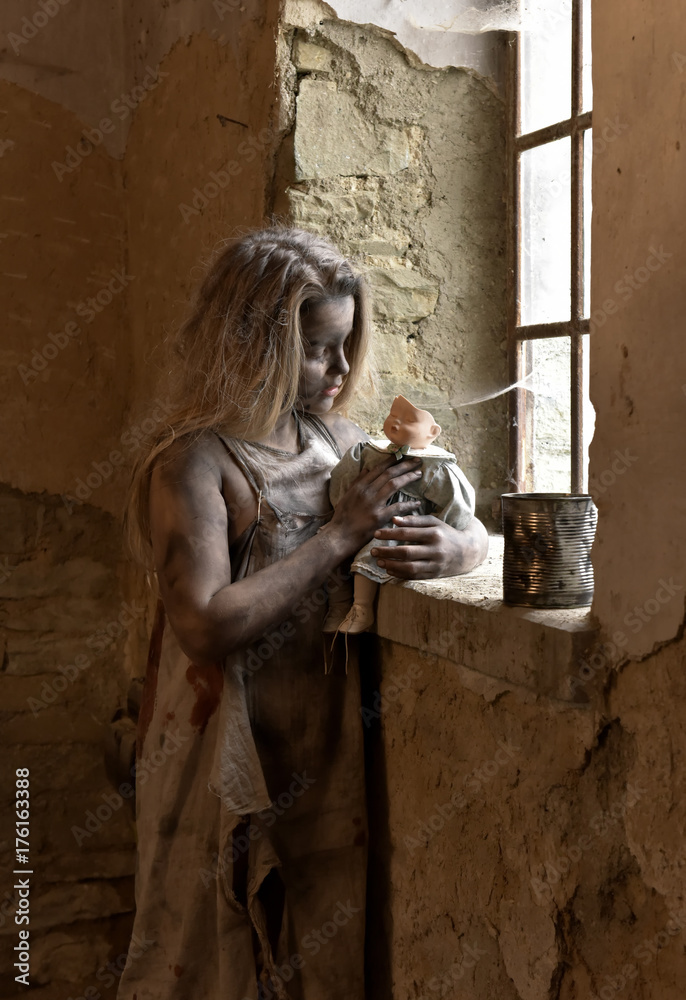 A scene of child poverty amongst children. The child is seen to be