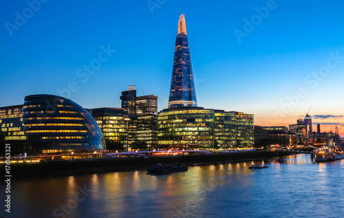 The view of London's city hall and modern skyscrapers at night photo