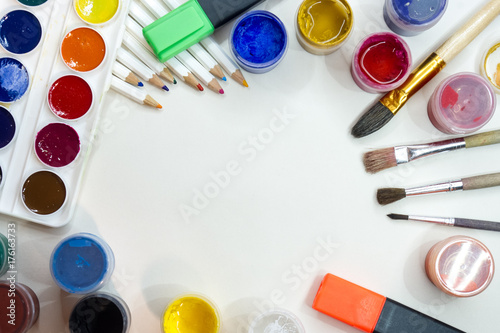 Hobby. Paints, brushes, pencils. White background