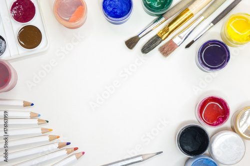 Hobby. Paints, brushes, pencils. White background