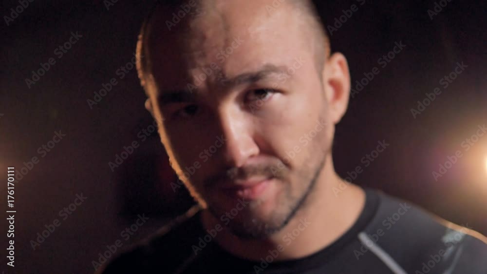 A front close-up view on a male mma fighters face. A front close-up view on a male mma fighters face.