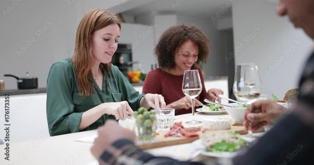 Friends enjoying a meal together Friends enjoying a meal together