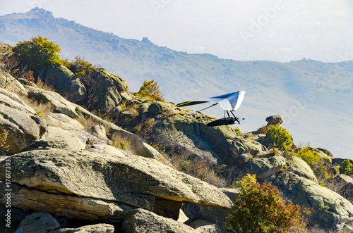 Glider taking off mountain rock in morning light photo