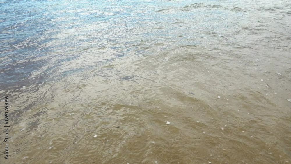 Soft wave of the sea on the sandy beach with Soft wave of the sea on the sandy beach with