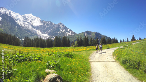 Photography POV from Old fashioned Montblanc tramway to two hikkers