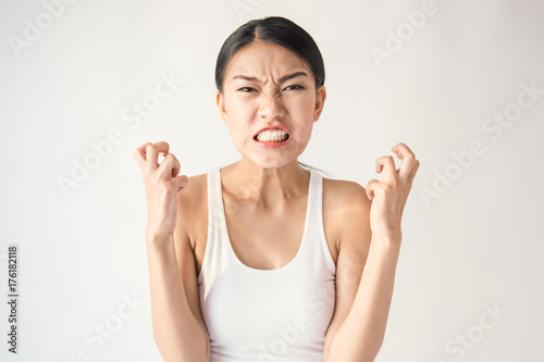Fotografie portrait of angry pensive mad crazy asian woman screaming out (expression, facial), beauty portrait of young asian woman madly panic isolated on white background
