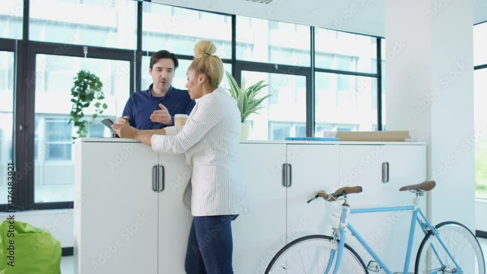 Cheerful casual business team working together in modern office Cheerful casual business team working together in modern office