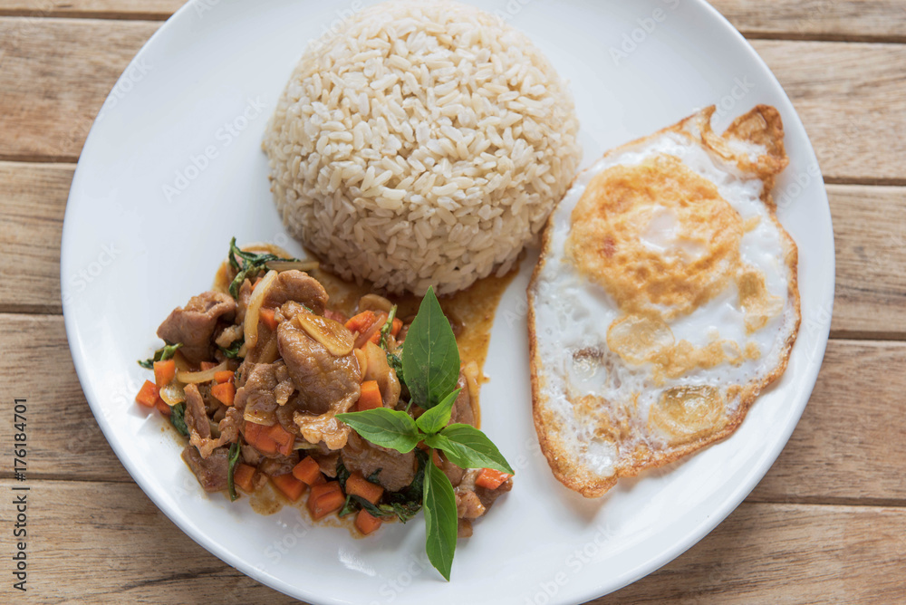 Stir fried pork with chili and basil, served with steamed rice and fried egg,Pad Kra-prao,Thai style food