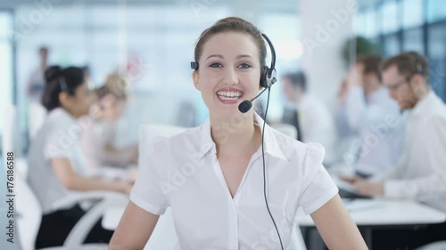 Friendly customer service adviser talking to a customer via video call