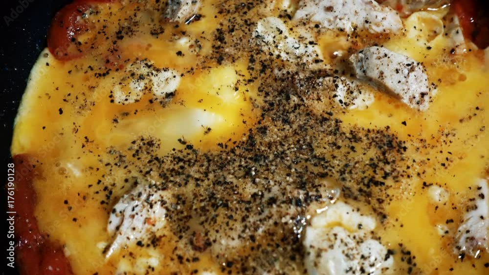 Preparation of eggs or omelets on a hot frying pan. Preparation of eggs or omelets on a hot frying pan.