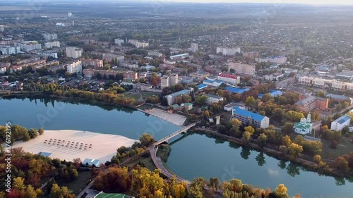 Aerial view on Mirgorod city, Ukraine. Old video style, low light evening sunset autumn footage photo
