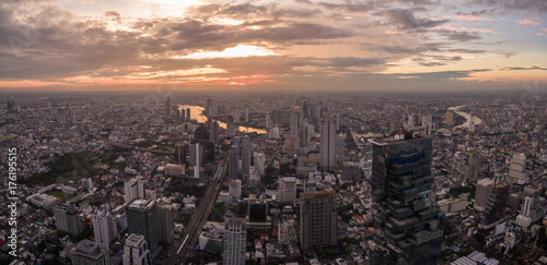High Aerial Panorama Shot At Dusk Over Sathorn District And Chao Phraya River, Bangkok, Thailand