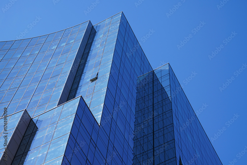 Low angle view of modern office building in blue color