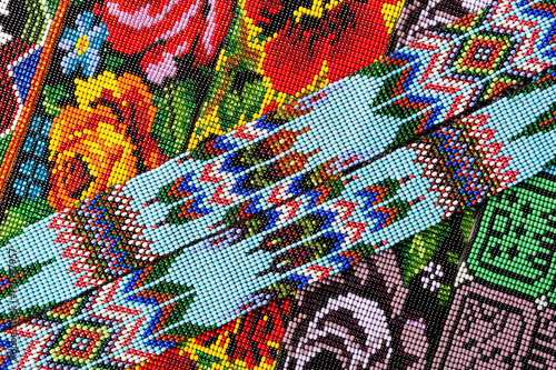 San Pedro la Laguna  Guatemala  closeup details of mayan traditional pattern created with small size glass beads