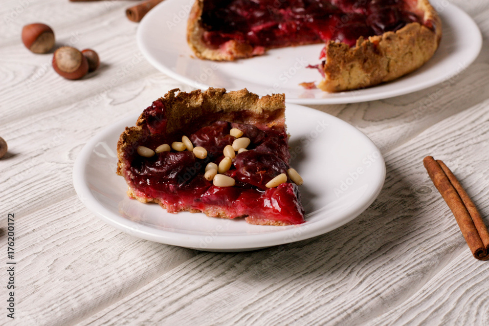 plum pie on a white plate plum pie on a white plate