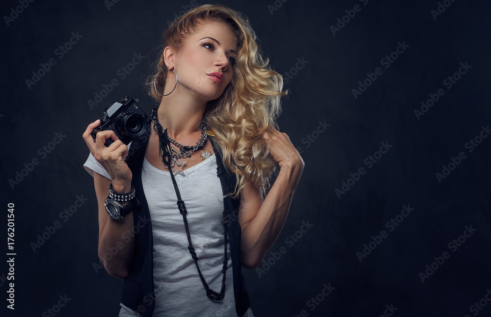 Female photographer taking pictures with a compact camera. Female photographer taking pictures with a compact camera.
