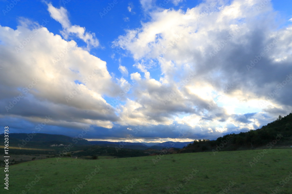 Dramatic landscape with cloudy sky in the French Pyrenees. Occitanie in south of France