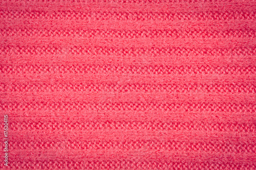 Knitted fabric - macro of a pink woolen texture