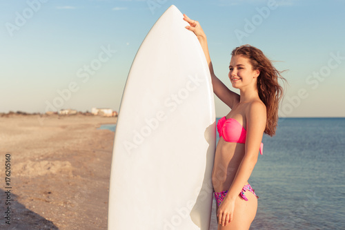 Surfer girl on the beach © fotofabrika
